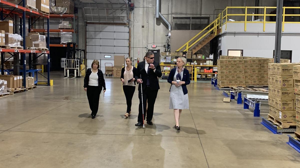 Rep. Spartz, Jeff Mittman and others walk the warehouse floor at Bosma Enterprises 