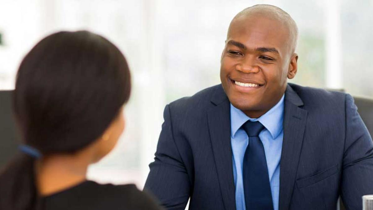 Boss having a conversation with young employee