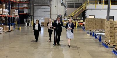 Rep. Spartz, Jeff Mittman and others walk the warehouse floor at Bosma Enterprises 