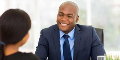 Boss having a conversation with young employee